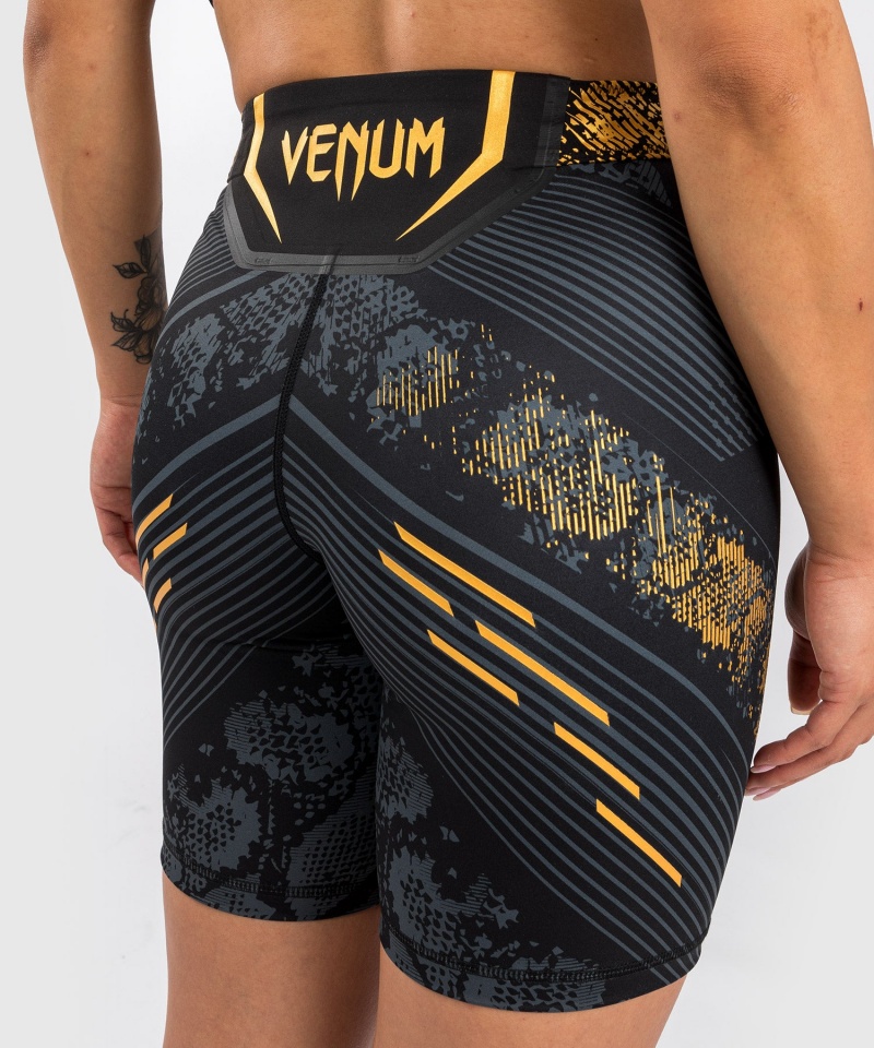 Venum UFC Adrenaline by Venum Authentic Fight Night Vale Long Fit Tudo Naisten Shortsit Kultaiset | 43196-JALP | Suomi